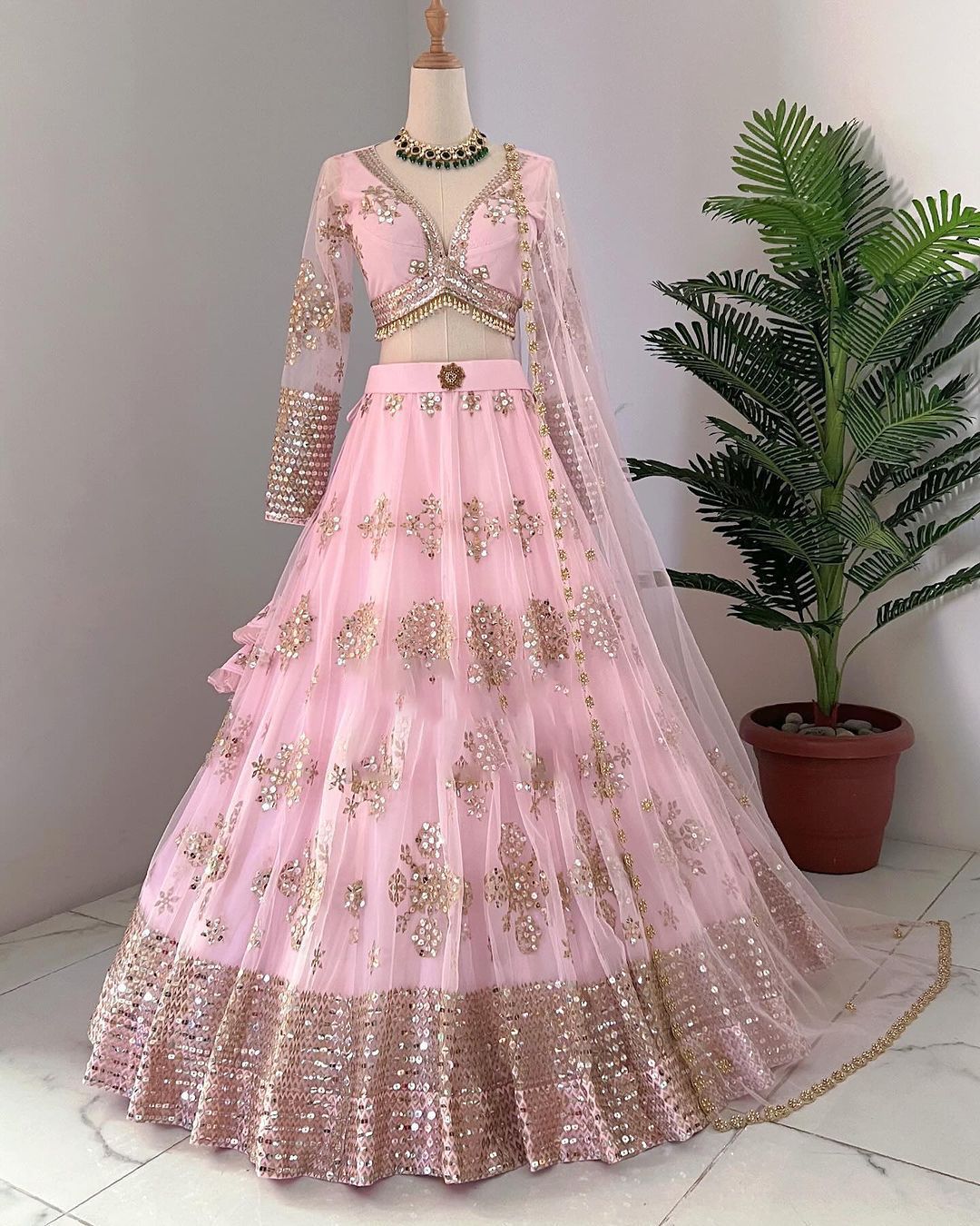 Ravishing Sequence Work Light Pink Net Lehenga Choli