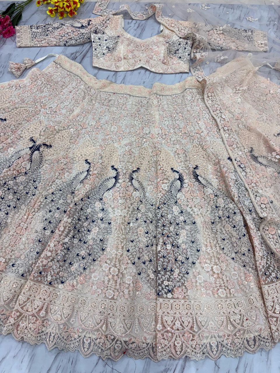 Bridal Wear Heavy Work Cream Color Lehenga Choli