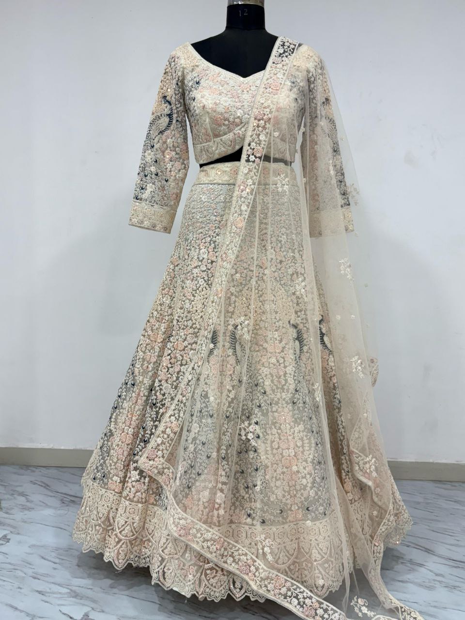 Bridal Wear Heavy Work Cream Color Lehenga Choli