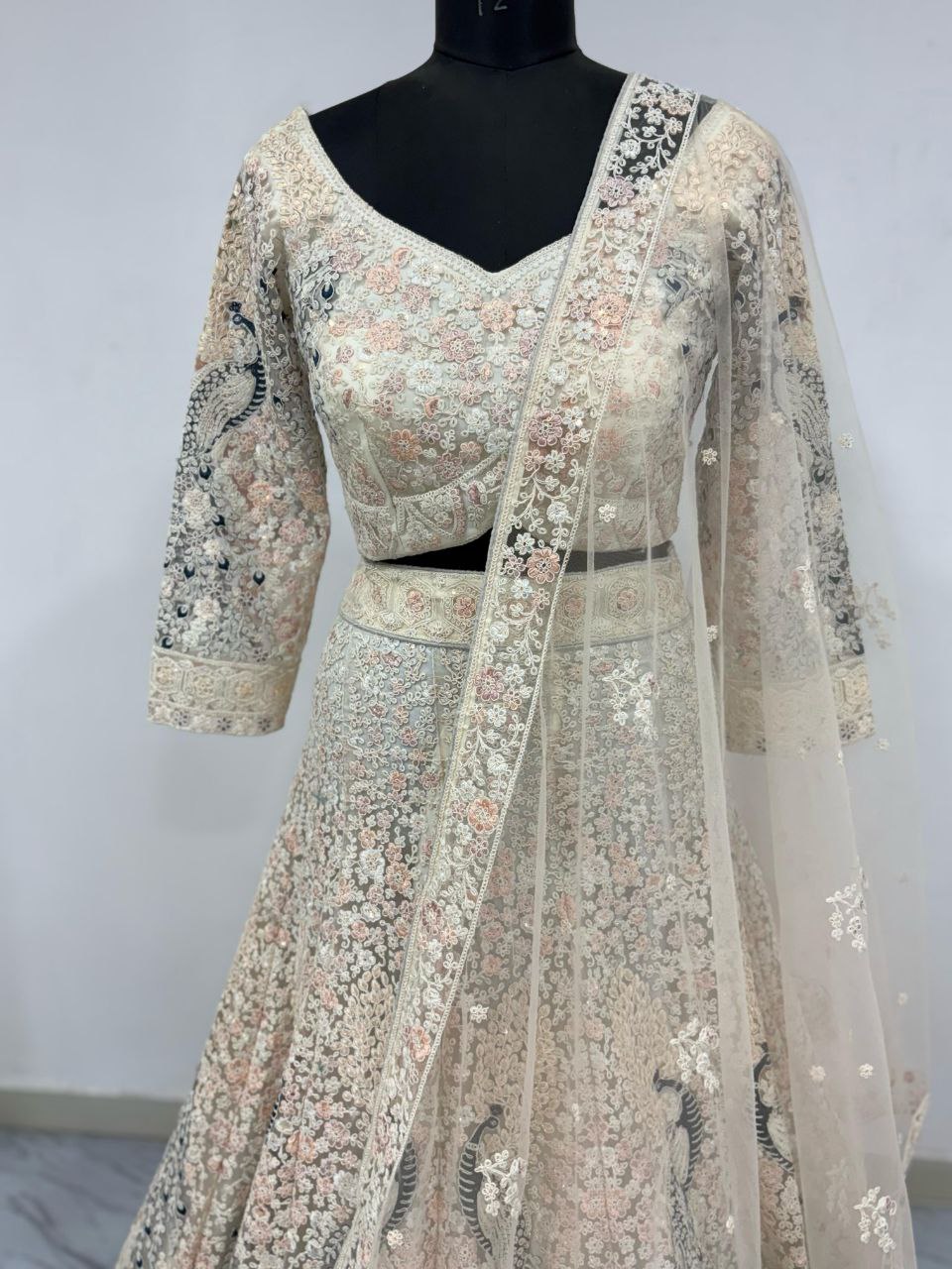 Bridal Wear Heavy Work Cream Color Lehenga Choli