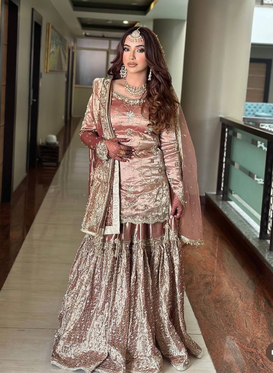 Preferable Heavy Work Peach Color Shining Sharara Suit
