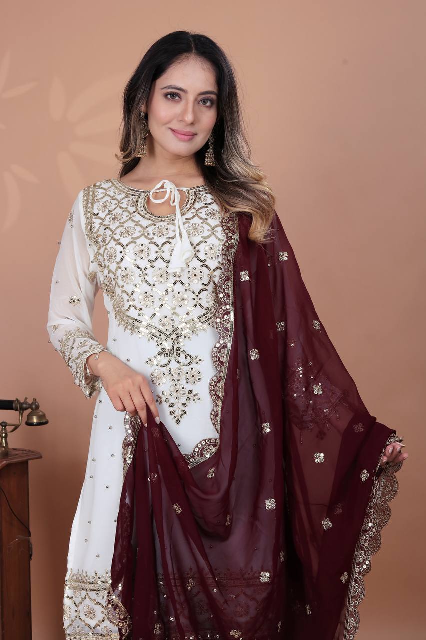 Fabulous Heavy Work White Color Suit With Maroon Sharara