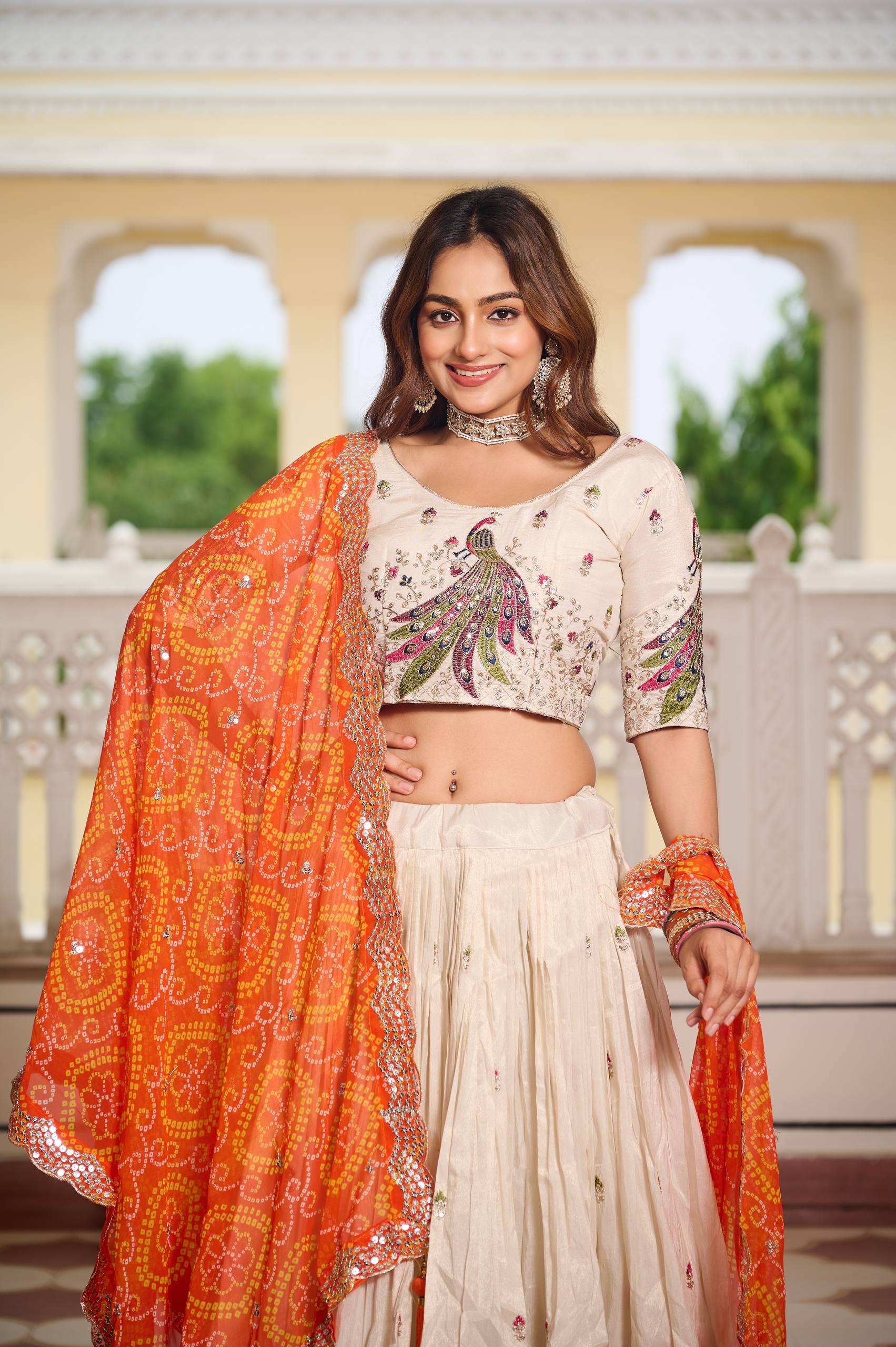Wonderful Embroidery Work White Color Lehenga With Orange Dupatta