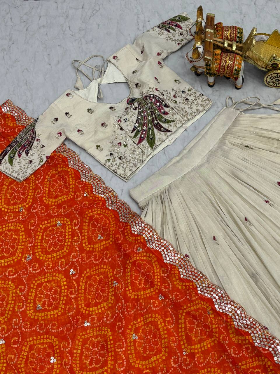 Wonderful Embroidery Work White Color Lehenga With Orange Dupatta