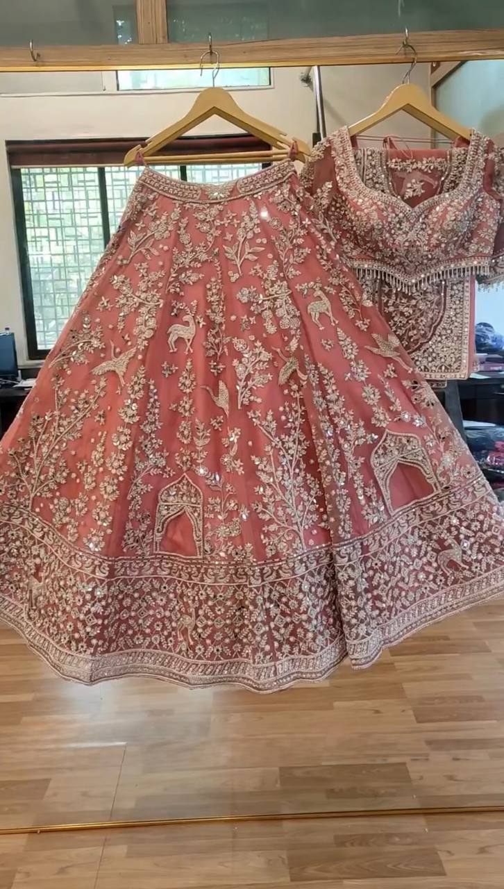 Lovely Peach Net With Embroidery Work Lehenga Choli