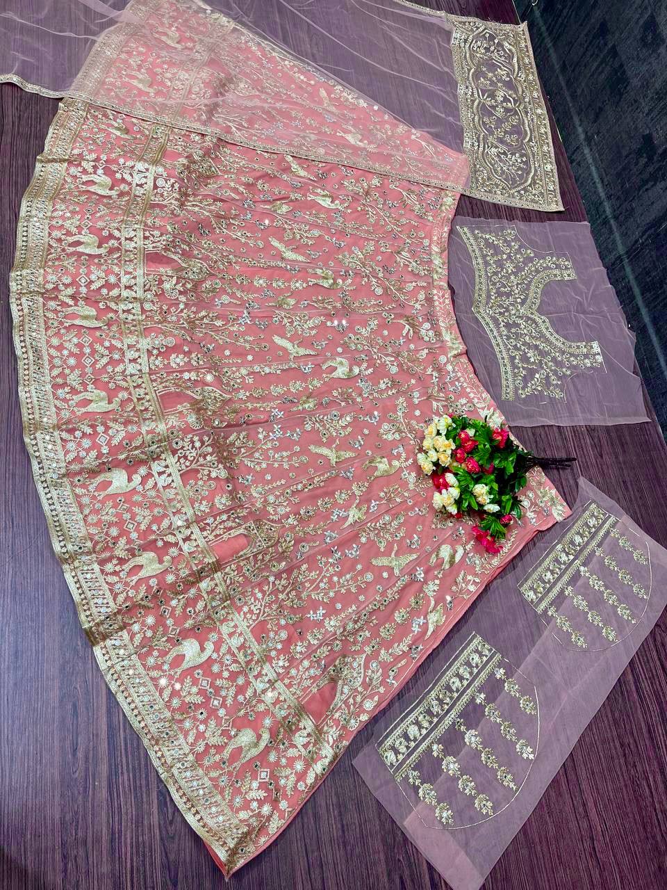 Lovely Peach Net With Embroidery Work Lehenga Choli