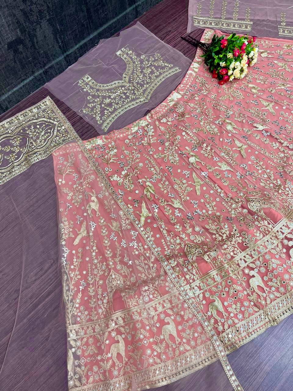 Lovely Peach Net With Embroidery Work Lehenga Choli